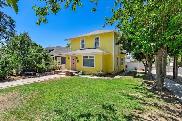 view of front of house with a front lawn