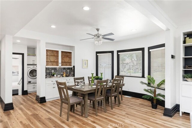 dining area featuring washer / clothes dryer, ceiling fan, and light hardwood / wood-style floors