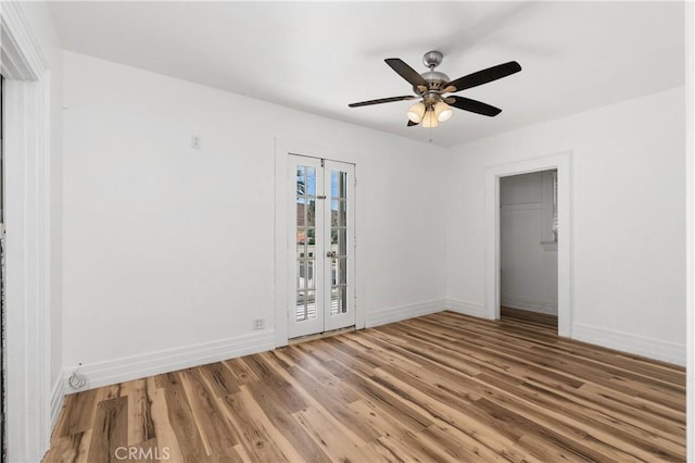 unfurnished bedroom with hardwood / wood-style flooring, ceiling fan, and a closet