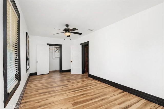 unfurnished bedroom with light wood-type flooring and ceiling fan