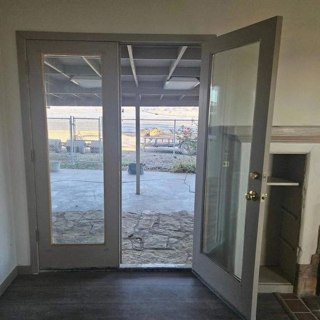 entryway featuring dark hardwood / wood-style floors and french doors