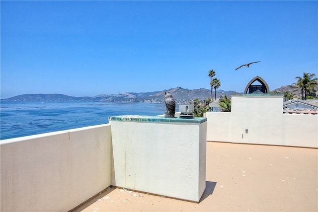 view of patio / terrace with a mountain view