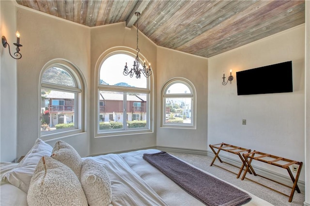 bedroom with wooden ceiling, carpet flooring, a notable chandelier, and multiple windows