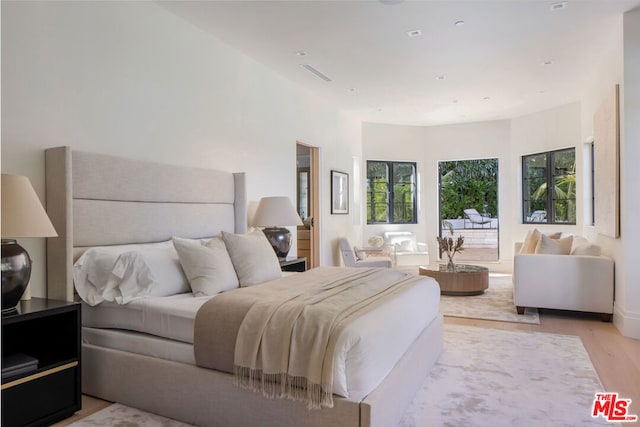 bedroom with light hardwood / wood-style floors