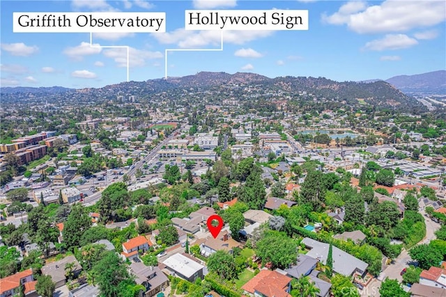 birds eye view of property with a mountain view