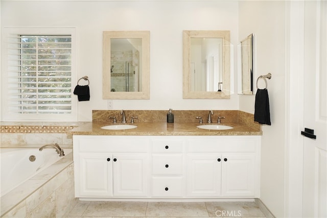 bathroom featuring vanity, shower with separate bathtub, and tile patterned floors