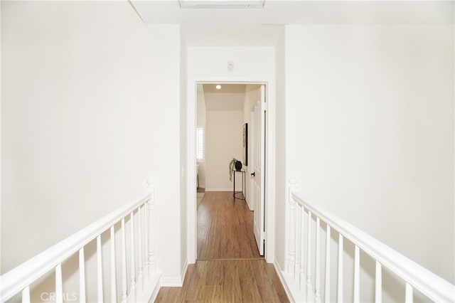 corridor featuring light hardwood / wood-style floors