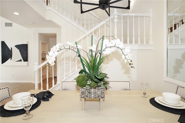 stairway featuring wood-type flooring and ceiling fan