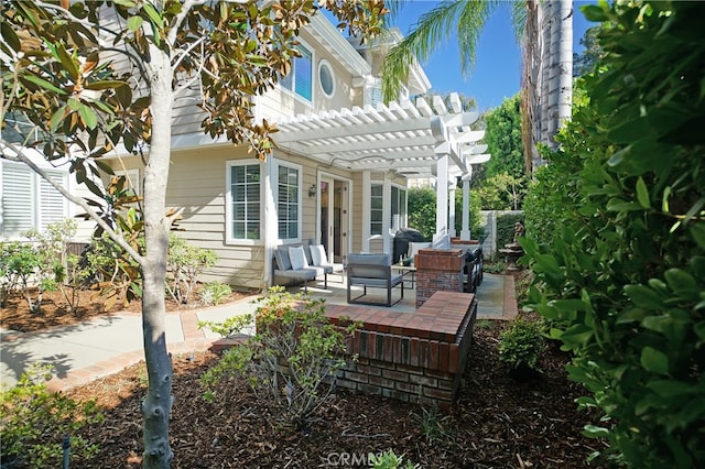 exterior space featuring an outdoor hangout area and a pergola