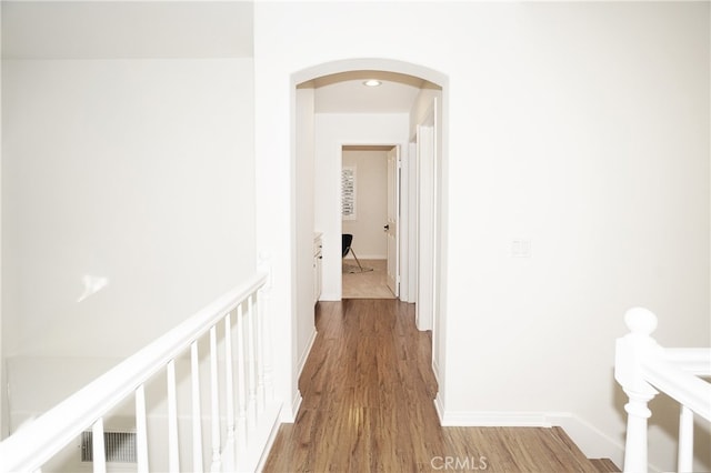 hallway featuring wood-type flooring