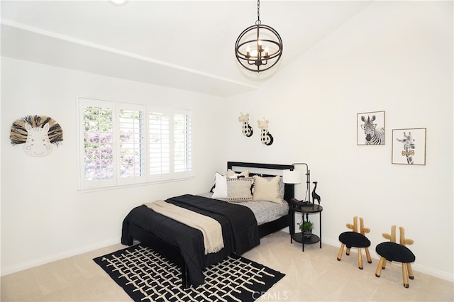 bedroom featuring lofted ceiling, light carpet, and a chandelier