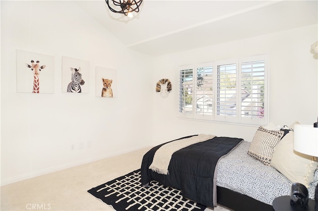 bedroom with carpet and vaulted ceiling