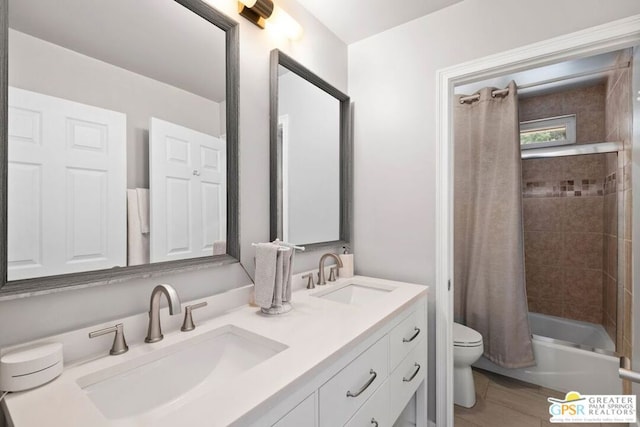 full bathroom featuring shower / bath combo, hardwood / wood-style floors, vanity, and toilet