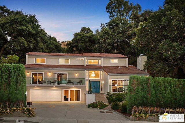 mediterranean / spanish house featuring a garage