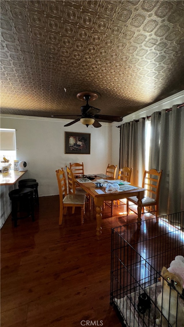 dining space with wood-type flooring and ceiling fan