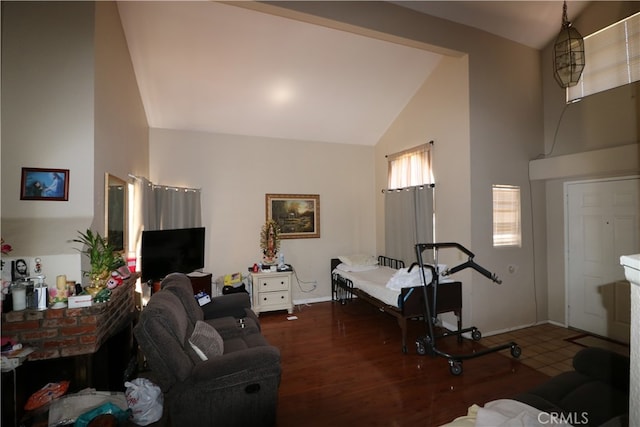 living room featuring dark hardwood / wood-style flooring and high vaulted ceiling