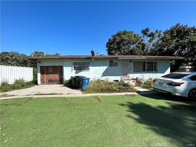 ranch-style home with a front yard