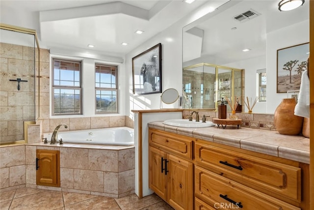 bathroom with vanity, separate shower and tub, and tile patterned flooring