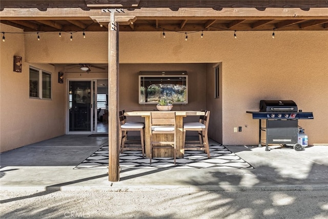 view of patio / terrace featuring a pergola, area for grilling, and ceiling fan