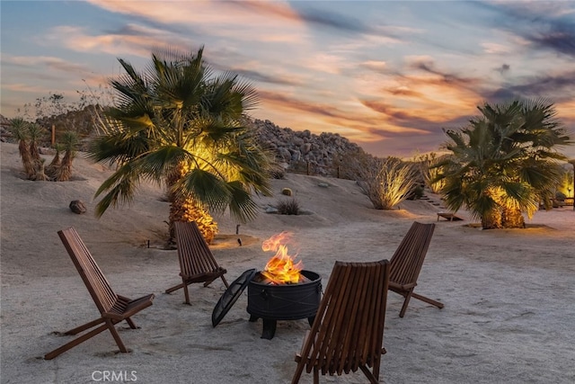 patio terrace at dusk with an outdoor fire pit