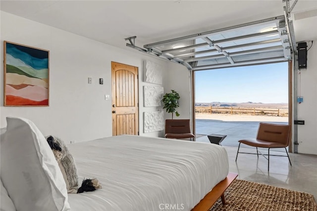 bedroom featuring a mountain view