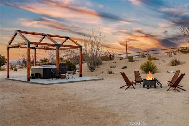 exterior space with a patio area and a fire pit