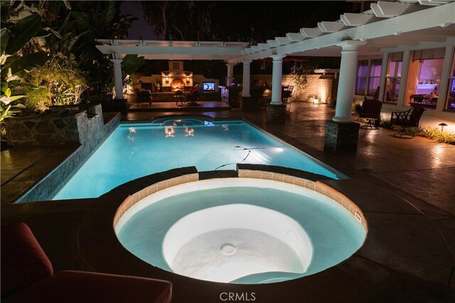 view of swimming pool featuring an outdoor fireplace, a patio area, a pergola, and an in ground hot tub