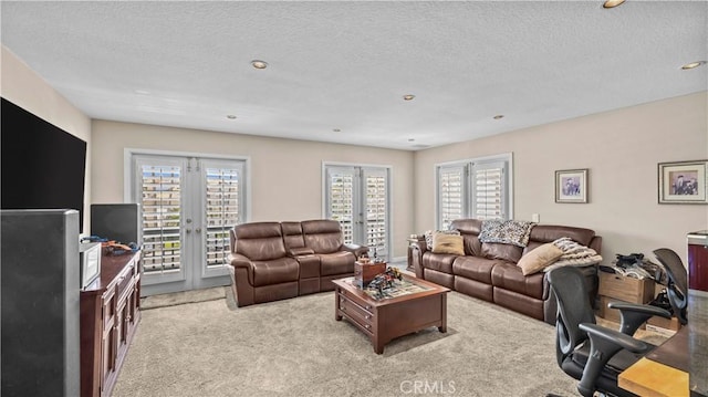 2221 Ventia, Tustin, CA 92782 - carpeted living area featuring french doors, recessed lighting, and a textured ceiling
