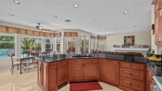 2221 Ventia, Tustin, CA 92782 - kitchen with a sink, ceiling fan, recessed lighting, open floor plan, and brown cabinets