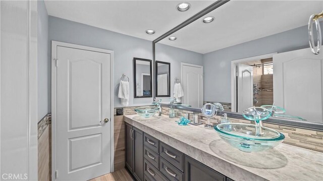 bathroom featuring hardwood / wood-style floors and vanity