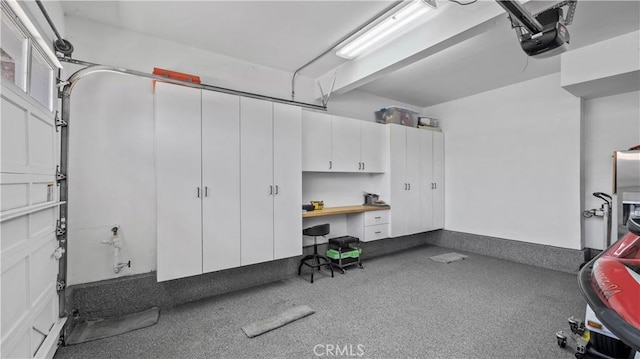 2221 Ventia, Tustin, CA 92782 - garage featuring a garage door opener and an office area