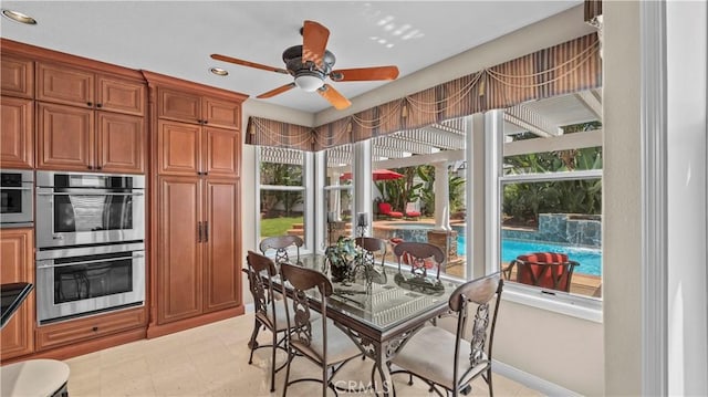 interior space featuring ceiling fan and double oven