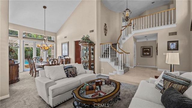 2221 Ventia, Tustin, CA 92782 - carpeted living area featuring a chandelier, high vaulted ceiling, stairs, and baseboards