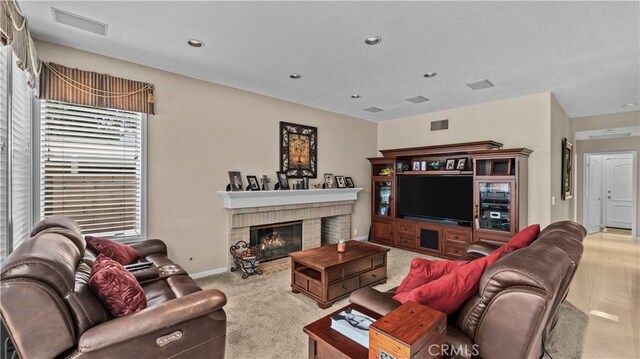 2221 Ventia, Tustin, CA 92782 - living area with a fireplace, baseboards, carpet, and recessed lighting