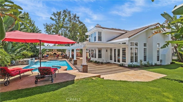 2221 Ventia, Tustin, CA 92782 - rear view of property featuring a pergola, a yard, a pool with connected hot tub, stucco siding, and a patio area