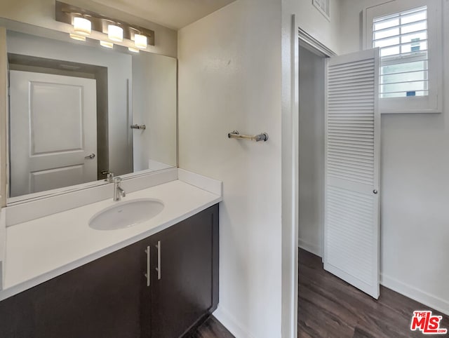 bathroom featuring wood-type flooring and vanity