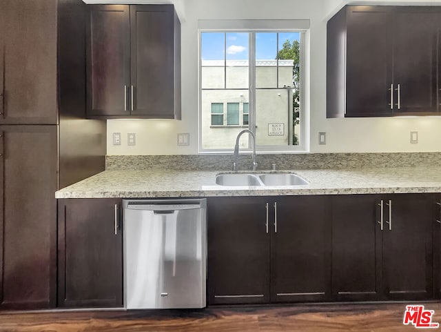 kitchen featuring dark brown cabinets, dishwasher, and sink