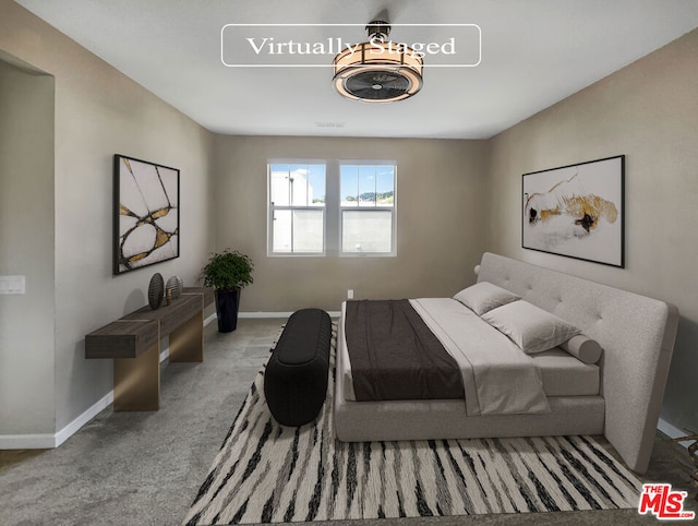 bedroom featuring light colored carpet