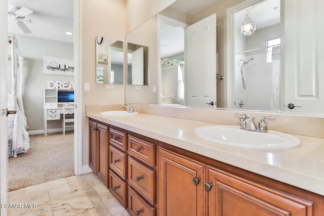 bathroom with vanity, plenty of natural light, and walk in shower