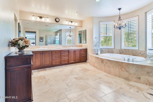 bathroom featuring plus walk in shower, vanity, and a chandelier