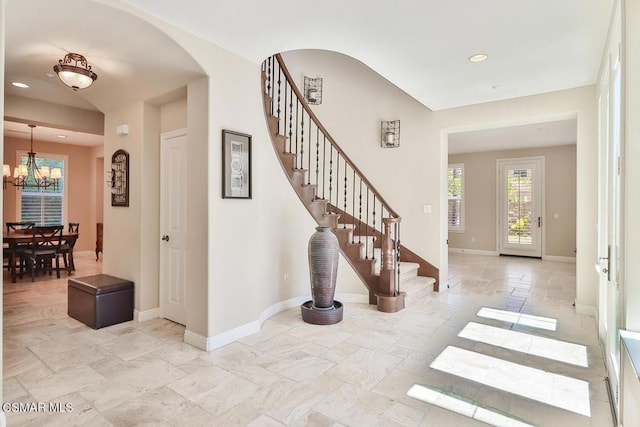 foyer featuring a notable chandelier