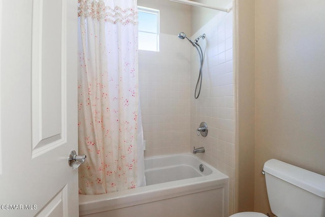 bathroom with toilet and shower / tub combo