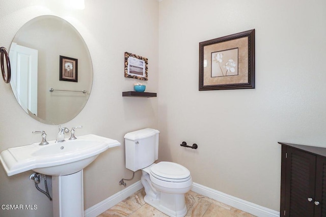 bathroom with toilet and sink