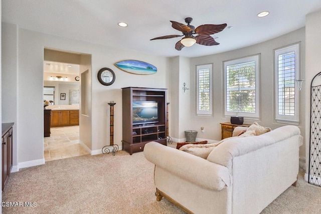 living room with light carpet and ceiling fan