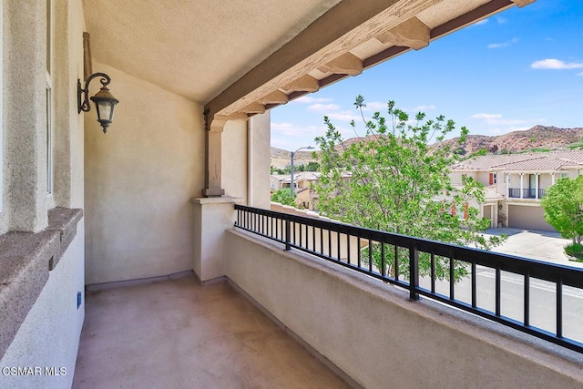 balcony featuring a mountain view