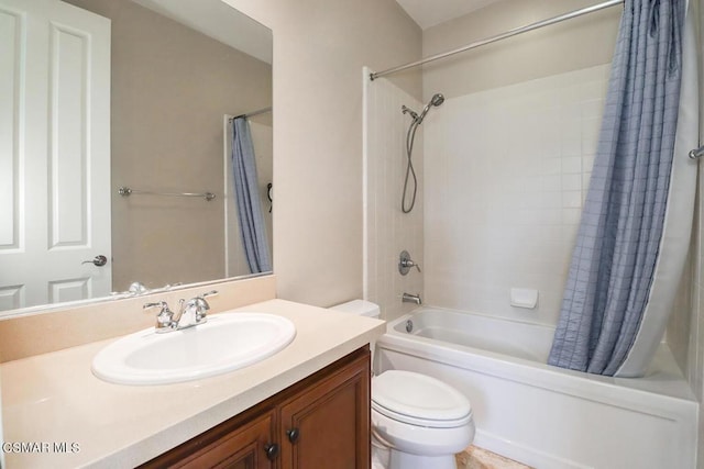 full bathroom with toilet, vanity, and shower / tub combo with curtain