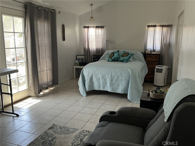 tiled bedroom featuring lofted ceiling