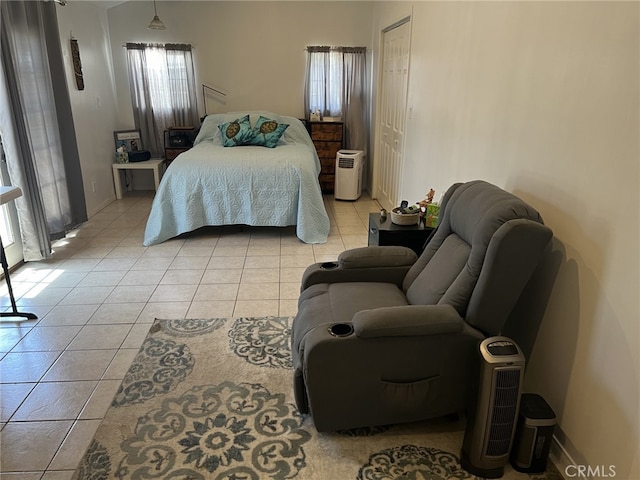 tiled bedroom featuring a closet