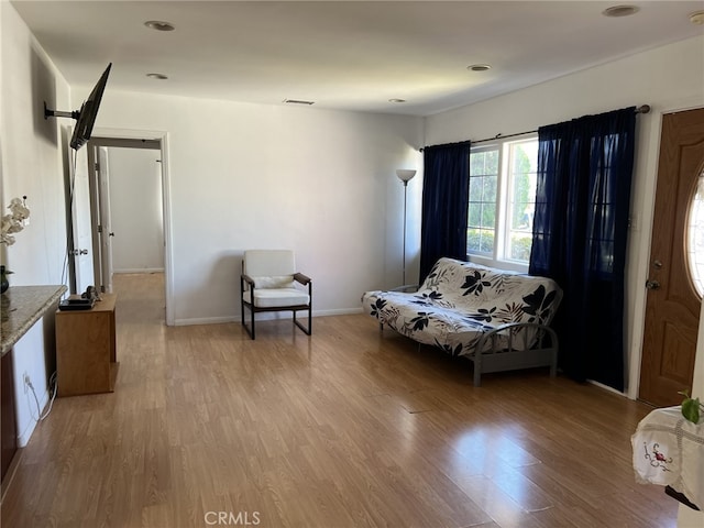 sitting room with light hardwood / wood-style floors