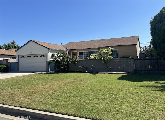 ranch-style house with a garage and a front lawn